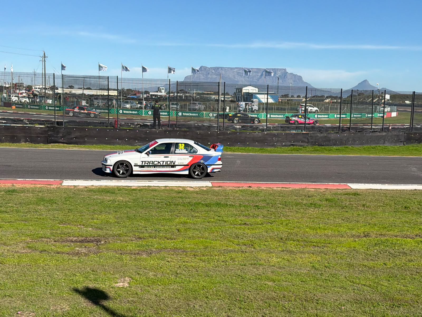 32 · Daniel Blaser · BMW E36 328i, with Table Mountain in the background